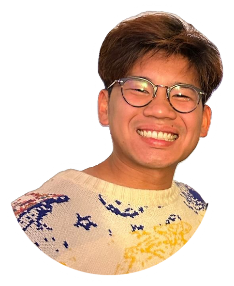 Brandon, smiling, in the same cream planet sweater and round glasses.