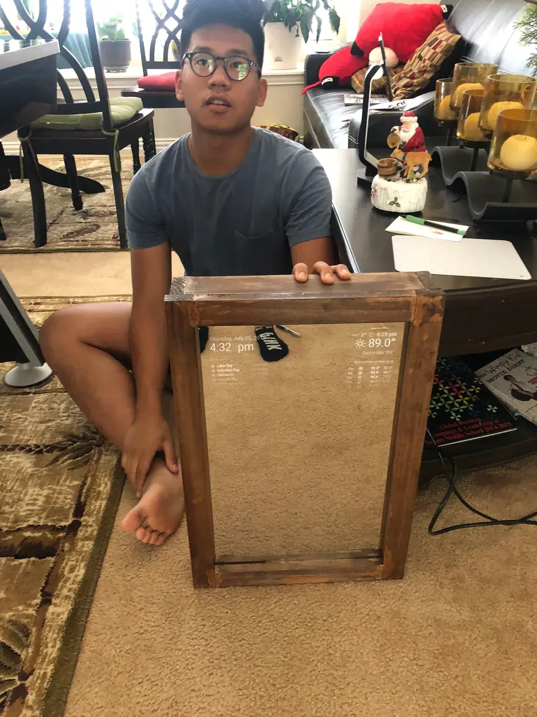 Me holding up the finished mirror.