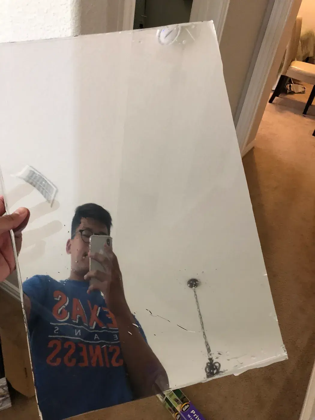 Me reflected in the two-way glass.