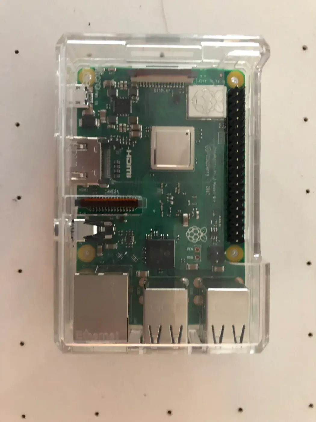 A Raspberry Pi in a clear case.