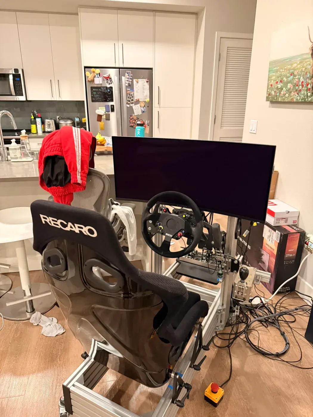 The first version: the Recaro seat and wheel in front of one monitor, cables everywhere.