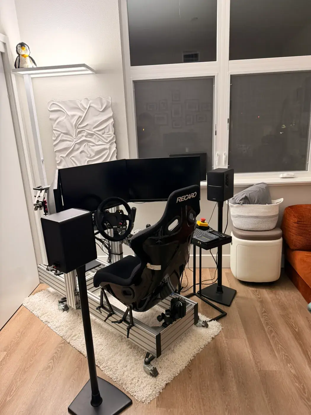 The rig between two bookshelf speakers on stands.